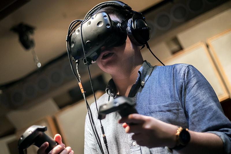 Person trying VR headset in listening room