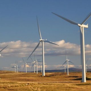 Image by Peechie247, sourced from https://www.pexels.com/photo/photograph-of-white-windmills-under-a-blue-sky-4877226/