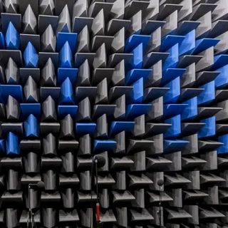 Interior of an acoustic anechoic chamber lined with specialized wedge-shaped sound-absorbing foam panels