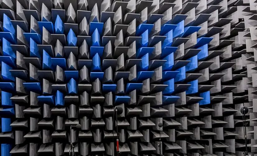 Interior of an acoustic anechoic chamber lined with specialized wedge-shaped sound-absorbing foam panels